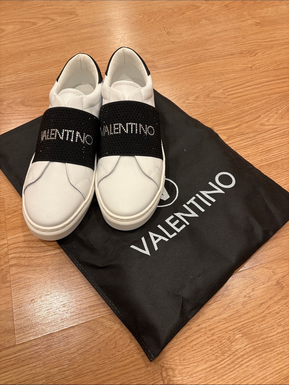 Valentino White Slip-On Sneakers with Black Crystal Logo Band